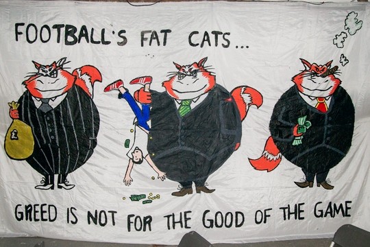 Footballs fat cats Image