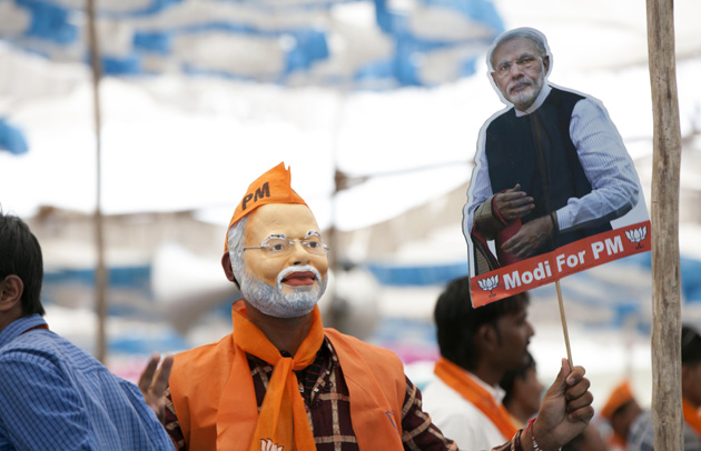 Man wearing a Narendra Modi mask at an election rally in Gujarat Image Prime Ministers Office Government of India