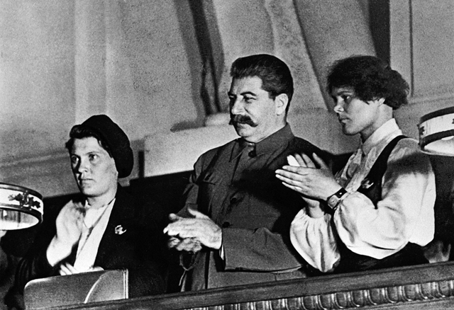 RIAN archive 377427 Stalin and famous collective farmers Demchenko and Angelina at the X Congress of the Young Communist League